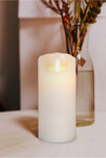 7" cream candle with flickering flame