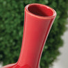 Large elongated red ceramic vase